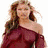 A woman with long brown hair appears in three distinct poses across a , wearing different outfits against varied backgrounds