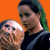 A 50x50 pixel animated contact sheet showing two frames of a Mystery Men movie-themed buddy icon with orange and green backgrounds, featuring characters from the film.