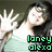 A person with long dark hair in a light green top raises both hands, displaying text below them that changes color across frames.