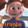 Animated character with red pigtails, wide eyes, and a broad grin showing teeth, wearing a blue shirt with orange text overlay.