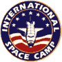 Circular logo icon featuring a space shuttle against an American flag-inspired background with stars and stripes, encircled by text reading "INTERNATIONAL SPACE CAMP" in white capital letters on a dark blue ring.