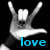 Pixelated hand making rock gesture with 'love' text in blue below, black background.
