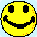 Two yellow pixelated smiley faces with black eyes and mouths, one winking, on a light blue background.