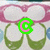 Animated sequence showing changing letters over a pattern of pink and green shapes with white circles.