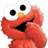 Red puppet-like character with large black eyes, orange nose, and open mouth in pixelated style.