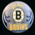 A circular hockey puck icon with a Boston Bruins logo and text, next to the phrase 'We Did It' in pixelated font on white background.