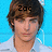 A pixelated image of a person with brown hair and a white shirt against a blue background, with text overlays changing across frames.