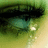 A close-up of a green-toned eye with tears, featuring pink text reading 'Tears Fall' on the right side.