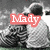 A grayscale image of two people embracing, with red text overlays reading 'Mady', 'and', and 'Eric' in different positions across the frames.