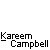 Pixelated cartoon figure in blue shirt and red cap with multiple poses above text reading Kareem Campbell on gray background.
