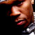 Pixelated close-up of a person's face with visible mouth and chin, dark background, partial shoulder view.