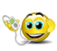 Yellow spherical emoji with blue eyes and black eyebrows holding a white-and-green MP3 player, smiling widely.