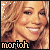 A pixelated contact sheet of two animated frames showing a smiling woman with long wavy blonde hair and the text "morich" at the bottom, displayed side-by-side on a gray background.