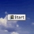 A pixelated rectangular icon with a white background and gray border, displaying a small dark square on the left and partial text 'st' in grayscale letters against a blue sky backdrop.