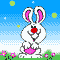 Two pixelated white rabbits with red noses stand on green grass under a blue sky, one holding a pink egg while the other holds a yellow object.