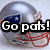 A silver football helmet with red straps and a blue stripe on the side, featuring bold text overlays that change between 'Go pats!' and 'screw giants!'.