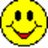 Yellow circular smiley face with black eyes and red mouth on white background, surrounded by pixelated text reading Look out for evil smiley faces.