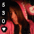 Pixelated image of a person with brown hair wearing a red garment, with vertical white numbers on the left and a heart symbol below.