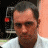 A 48x48 pixel buddy icon split into two frames showing a person on the left and "Fear Factor" text on the right, with visible pixelation and color banding.