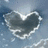 A static image with a heart-shaped cloud formation on the left and green pixelated text on red backgrounds. The right side displays "JELOUS OH NO" above "THAT'S WHAT I THOUGHT."