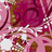 A static image of a repeating pattern featuring swirling floral motifs in shades of pink and brown with white accents.