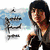 A pixelated image of a person with dark hair holding an object, overlaid by text reading "You're the voice I hear inside my head." and six colored hearts.