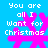 Blue background with white text reading "You are all I want for Christmas" and pink snowflake-like shapes in four quadrants.