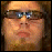 six pixelated showing a person with glasses, text reading RAKE YOHN on blue gradients, and a split-face expression