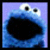 A pixelated blue cartoon character with large eyes and an open mouth next to blue text reading "I love cookies" on a black background.