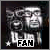 Pixelated grayscale image of a person with two distinct facial expressions, one smiling and one neutral, in a side-by-side layout with 'FAN' text below.