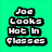 Green background with black-and-white text reading "Joe Looks Hot In Glasses" and "Say Hello To Beautiful" above a person holding a microphone.