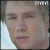 Static pixelated image of a person's face with light brown hair, visible eyes and nose, mouth slightly open, and 'CMM' text in top-right corner.
