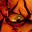 Pixelated close-up of a character's face with orange skin and cracked texture, below text reading "SEED OF CHUCKY NOV 12" in red and white.