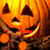 Pixelated orange pumpkin face with triangular eyes and a wide toothy grin, next to text reading 'SEXY pumpkin' and a heart symbol on black background.