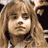 Static 48x48 pixel buddy icon showing a close-up of a person with light brown hair and neutral expression against dark background.