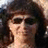 A four- with a pixelated photo of a woman in the top-left, blue backgrounds with text in the top-right and bottom-left, and a gray in the bottom-right