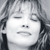 Static grayscale pixel art of a person's face with closed eyes, visible hair strands, and minimal facial features rendered in low resolution.