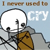 Pixelated cartoon character with white head and black eyes holds brown envelope against light blue background with text "I never used to CRY".