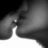 Black-and-white close-up of a person's face kissing another person, next to bright cyan background with pink pixelated text.