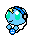 Pixelated blue character with green eyes, yellow star on headband, and small blue smiley face icon in hand.