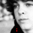 Black-and-white photo of a person with curly hair, red pixelated text reading 'i', 'love', and 'ryan!' appears sequentially over the image.