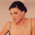 A pixelated image of a person with short dark hair wearing a sleeveless top, positioned next to green text reading 'Original Icons .com' on a solid background.