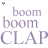 Purple text 'boom' and 'CLAP' repeated in two with small purple asterisks above each on a white background