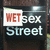 A static icon displays 'WET sex Street' text with 'WET' in red on a white rectangle over a dark background.