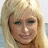 Pixelated image of a person with long blonde hair on a light cyan background, with repeated text elements in pink pixelated font.