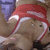 Animated icon of a character in red and white wrestling attire with a purple background, showing slight movement in the head and limbs.