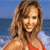 A pixelated static image shows a person with light brown hair wearing a red bikini top against a blue water and sky background.