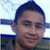 Pixelated static image of a person with short dark hair, light skin, and a neutral expression against a light background.