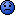 Pixelated blue circular icon with black facial features on gray background, displaying a neutral expression.