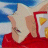 A pixelated figure in a red garment with a light-colored head covering, holding a white object with a yellow section against a blue and white background.